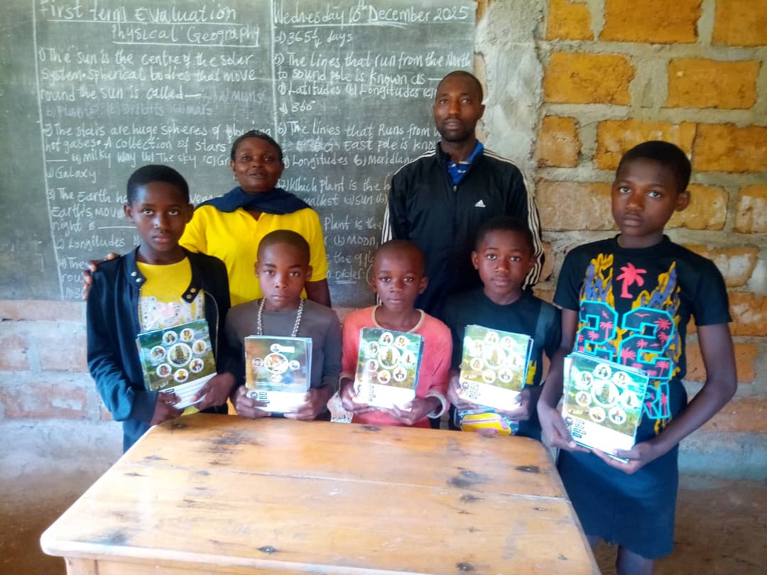 Students receiving exercise books in the classroom — Lebialem Division